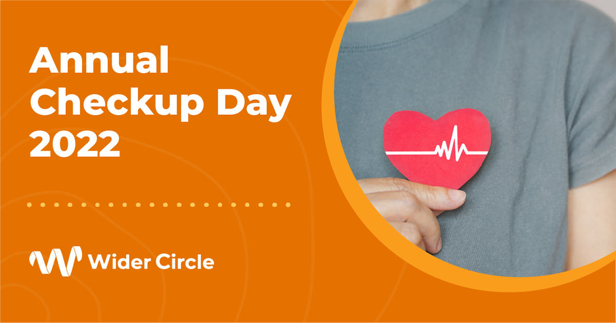 WC-Annual Checkup Day_Social Media Ad_v2 Photo of senior holding a paper heart to her chest. Wider Circle logo is displayed to left of photo.